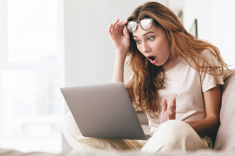 Woman in Glasses Shocked at Computer Image