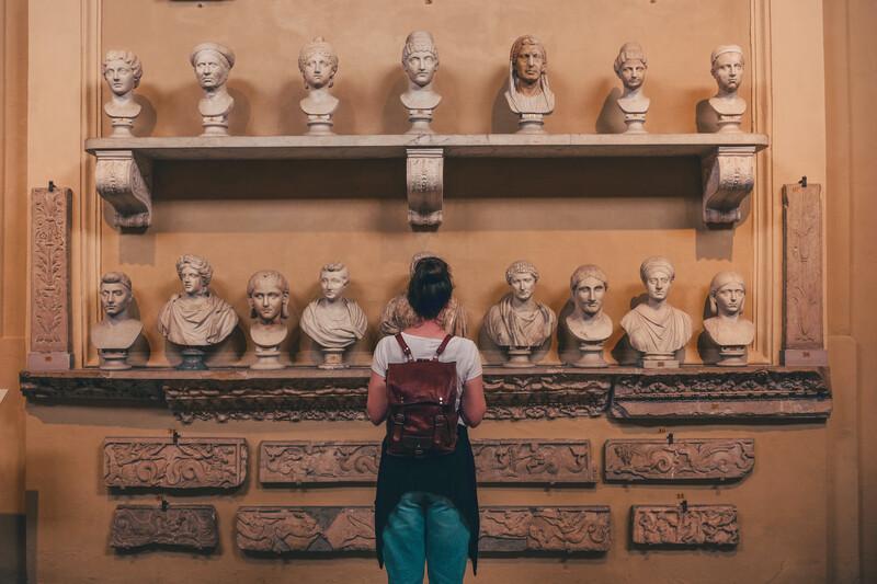 woman looking at art exhibit