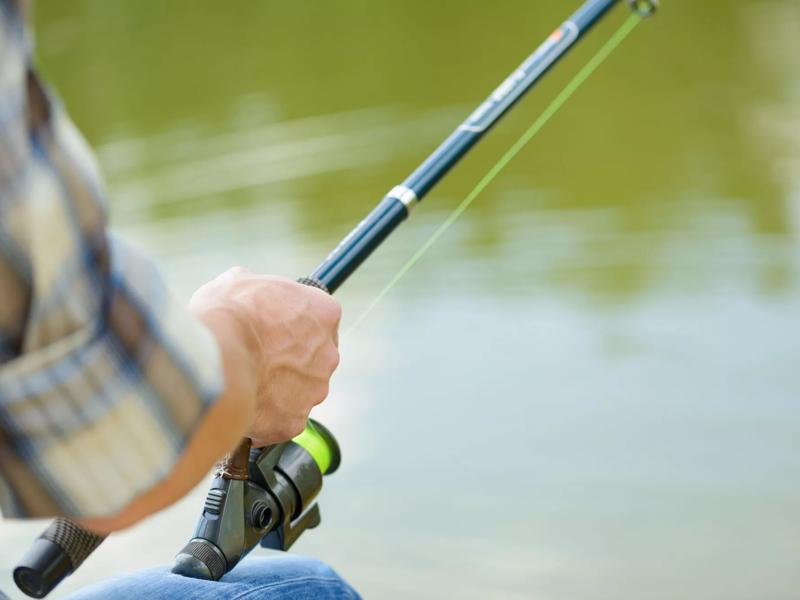 man fishing at dock