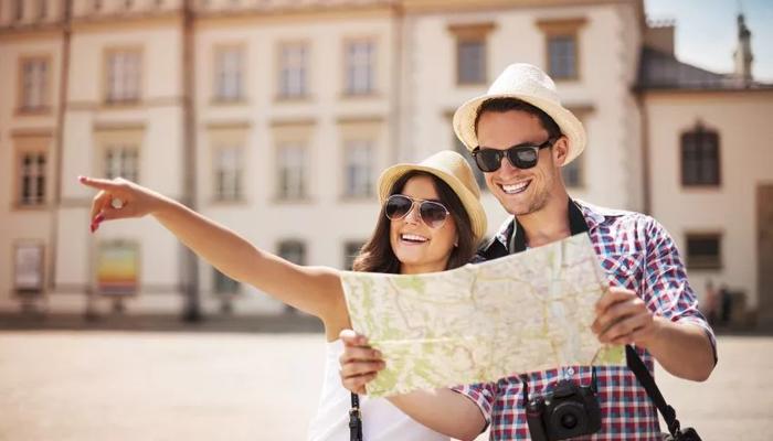 traveling couple exploring with map