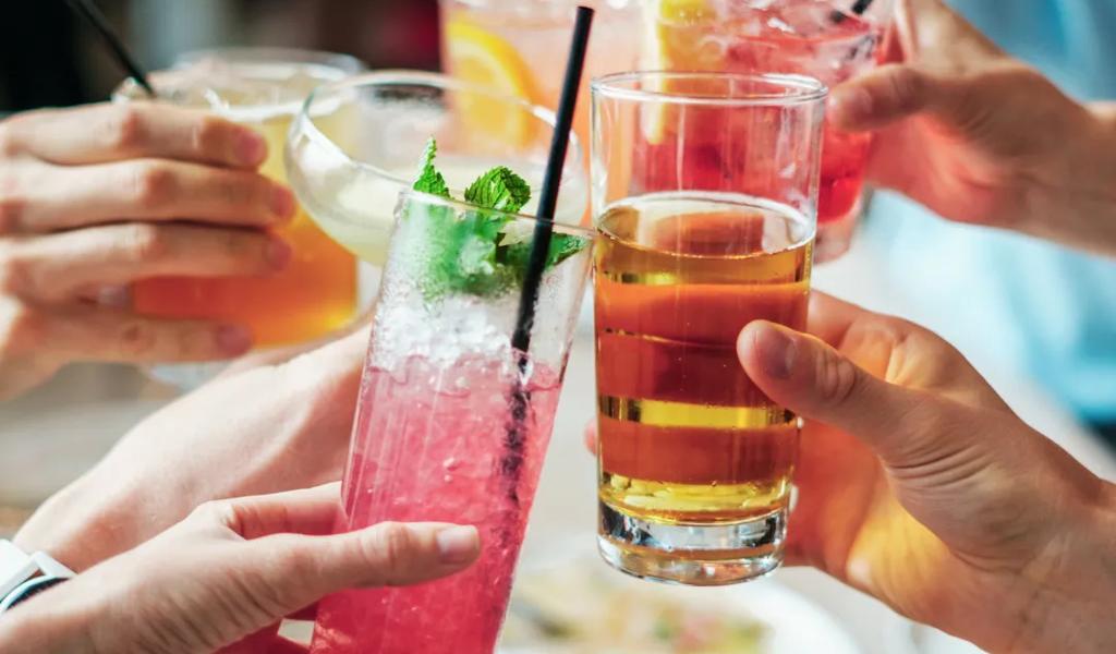 People toasting with drinks