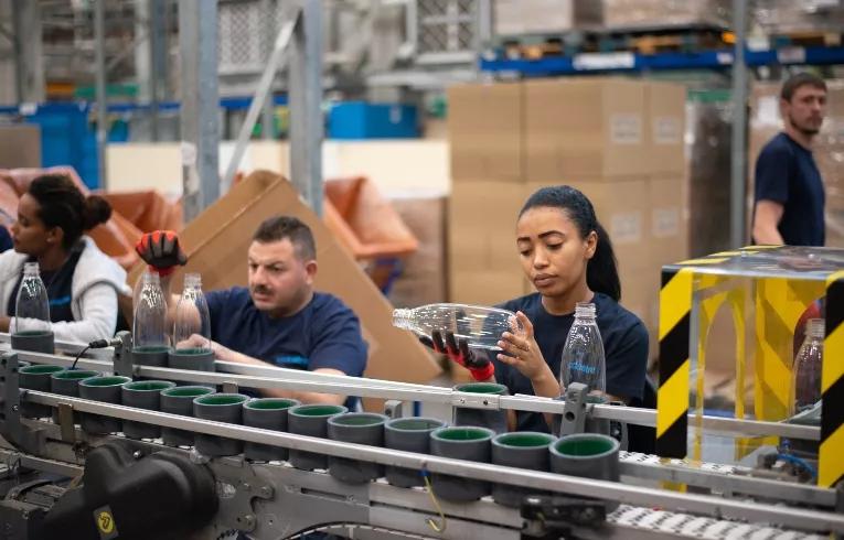 people working on an assembly line