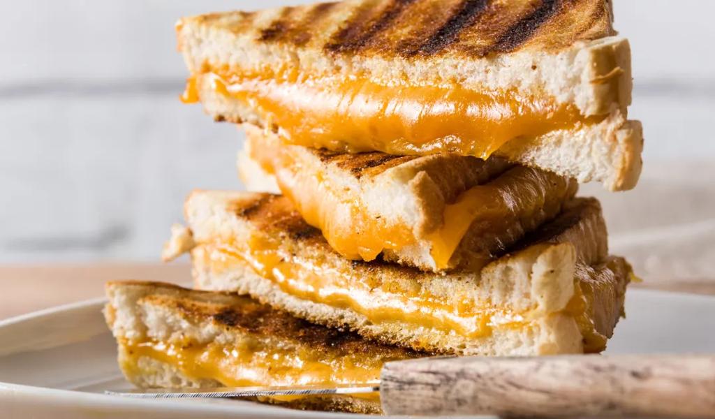 A stack of grilled cheese melted to perfection 