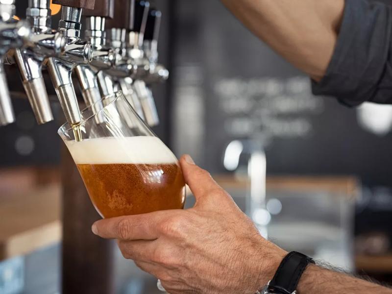 bartender filling beer glass