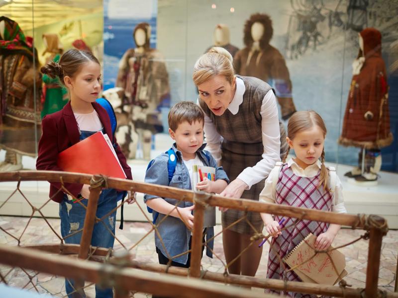 people looking a museum exhibit