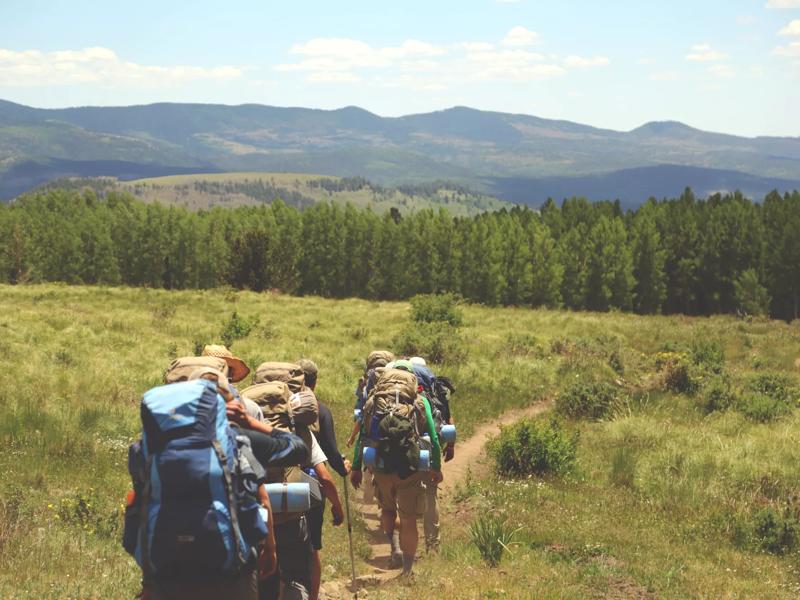 three people hiking