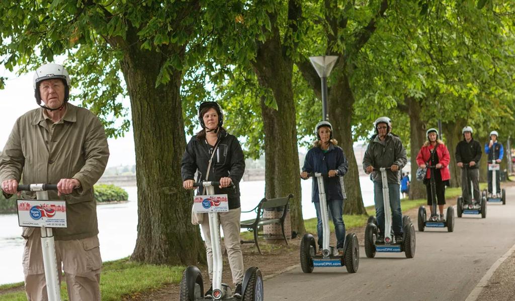 Group riding segways outdoors