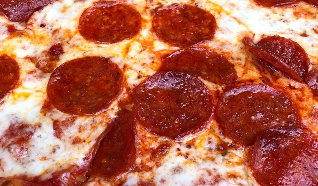 A close up of a cheesy and pepperoni pizza from Five Points Pizza in East Nashville