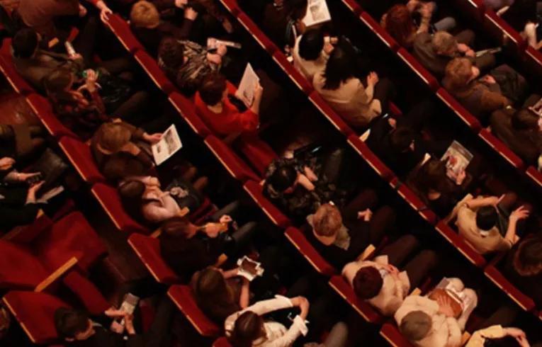 people sitting at a theatre