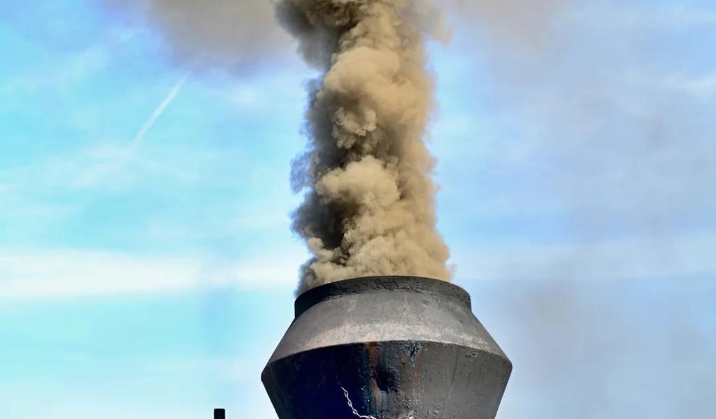 Steam engine emitting smoke.