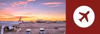 sunset at airport with airplane on tarmac, airplane icon adjacent