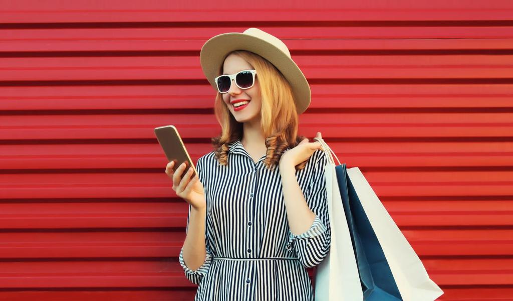 Happy young woman on a mobile phone