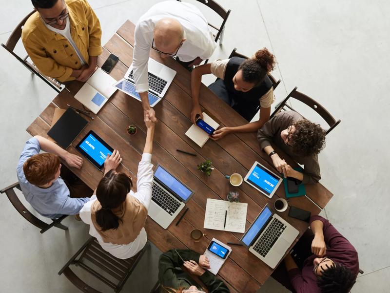 overhead of team meeting around table