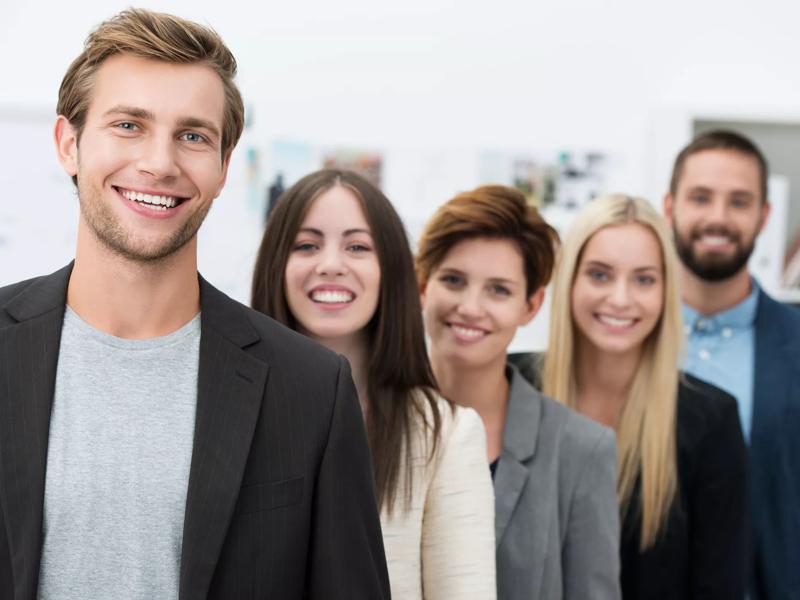 group of smiling people with thumbs up approved icon