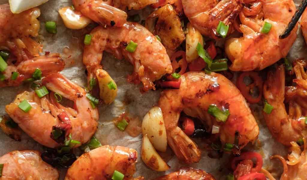 Grilled shrimp with lemon and green onions.