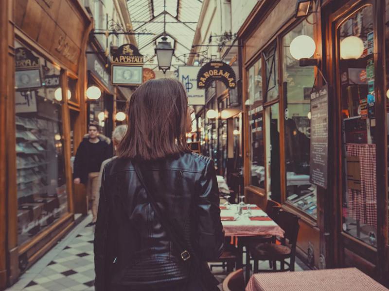 unique shopping experience with woman walking in a hallway