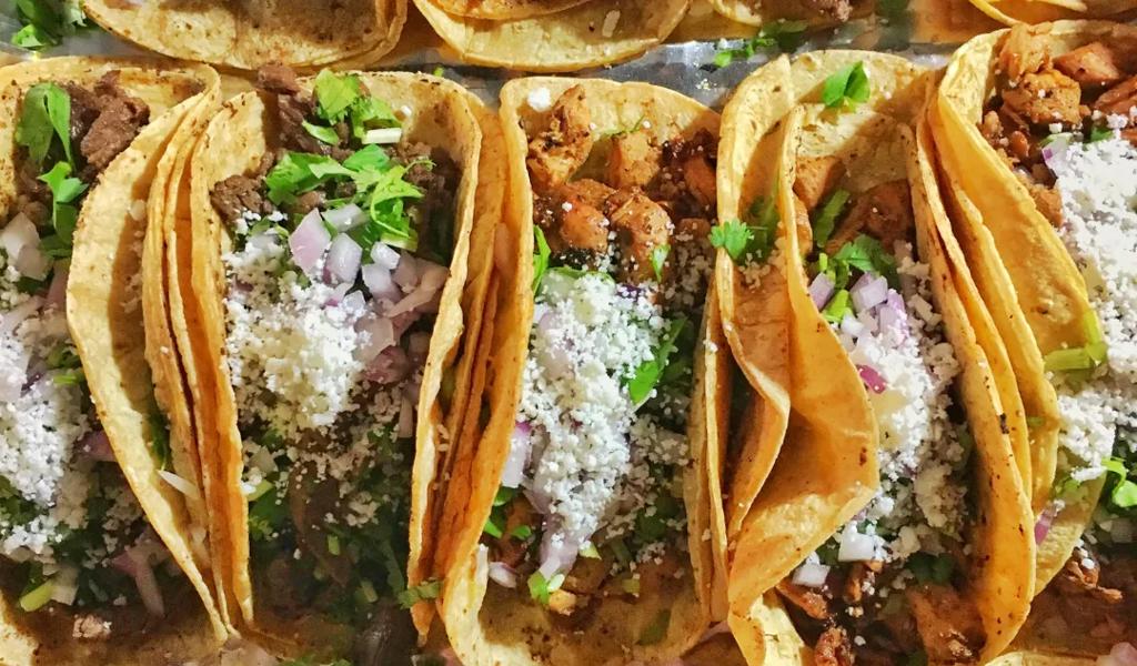 Close-up of tacos with meat and toppings