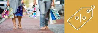 women with shopping bags and price tag icon