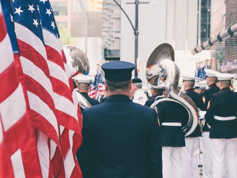 soldier in front of an American flag