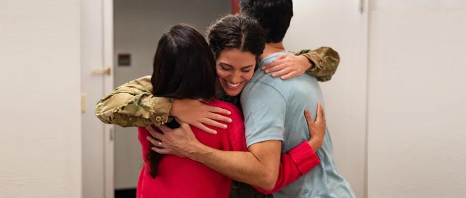 Military family hugging