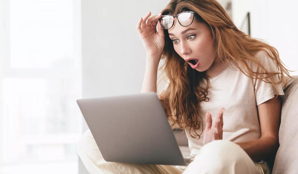 Woman Glasses Shocked at Computer