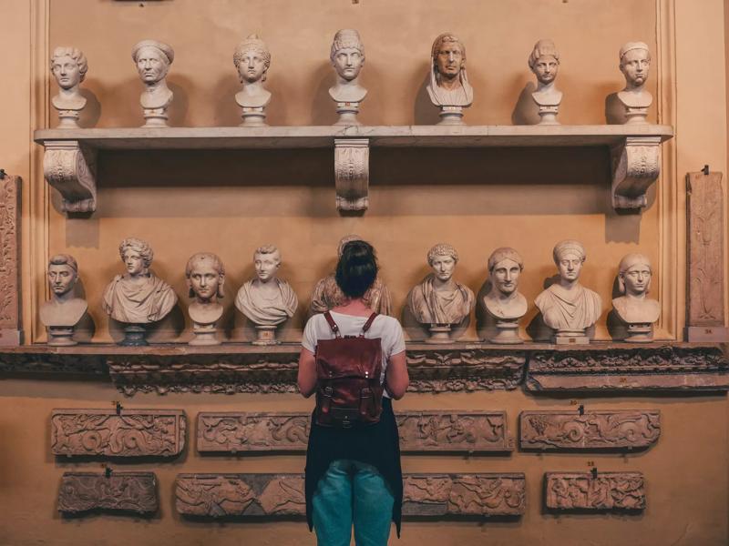 woman looking at art exhibit