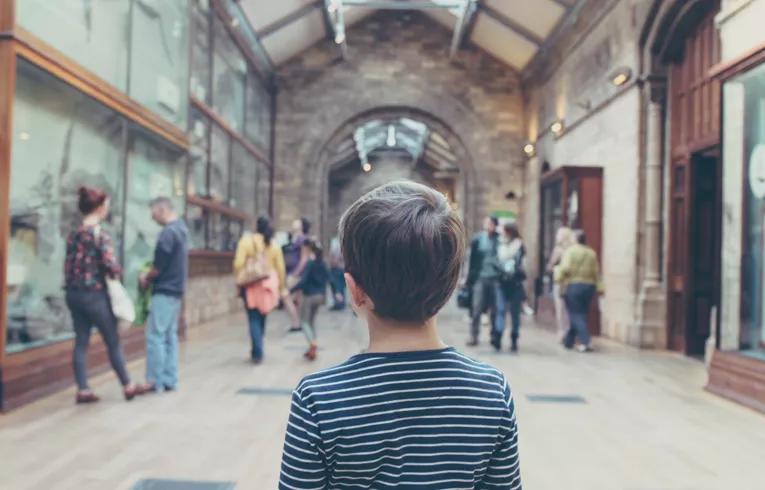 child in museum hallway