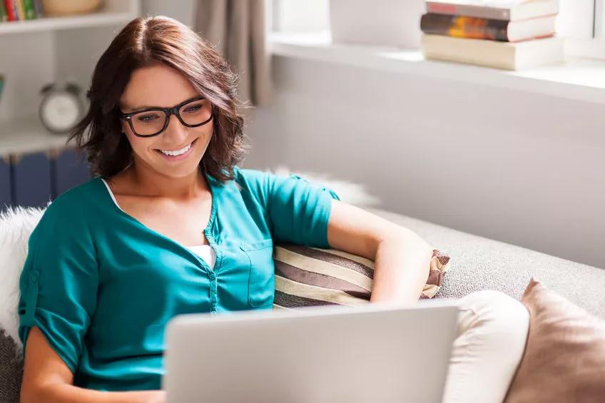 woman on laptop with wifi