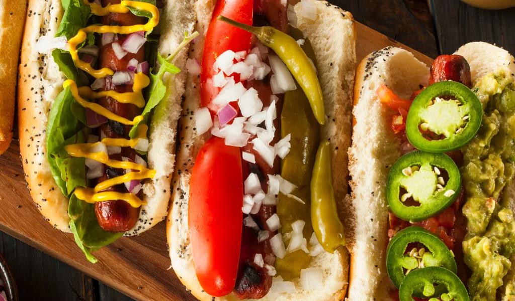 Gourmet hot dogs with various toppings