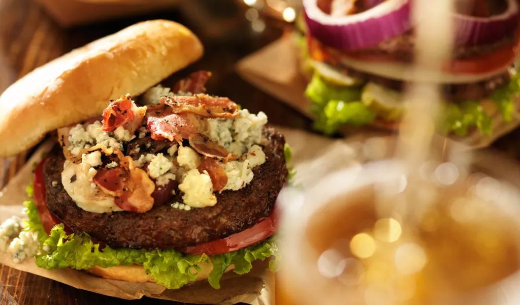 Gourmet burger with fries and beer