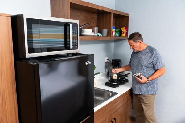 man cooking in hts kitchen