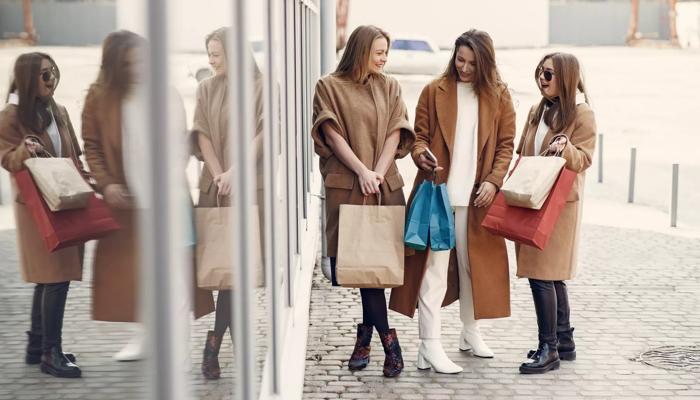 women carrying shopping bags