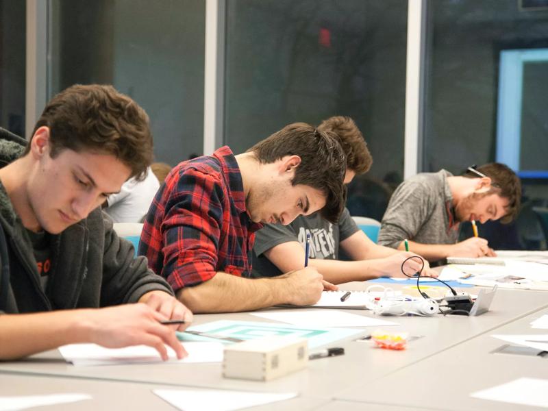 college student working at a table